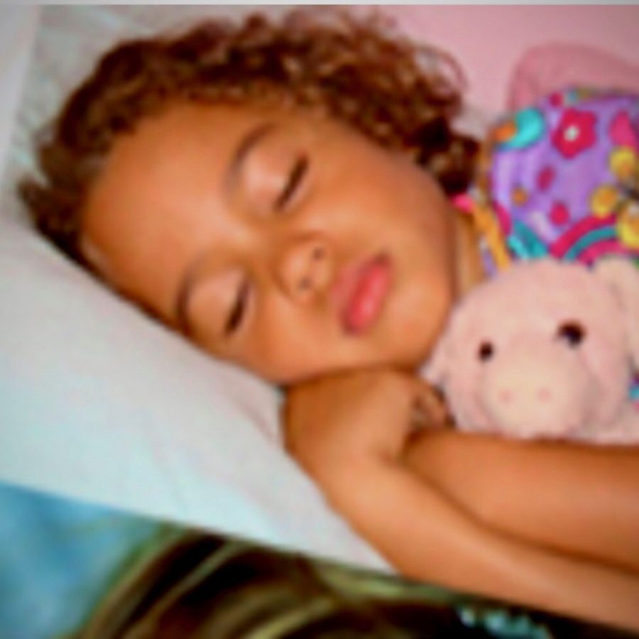 Young Girl Asleep With A Pig Stuffed Animal